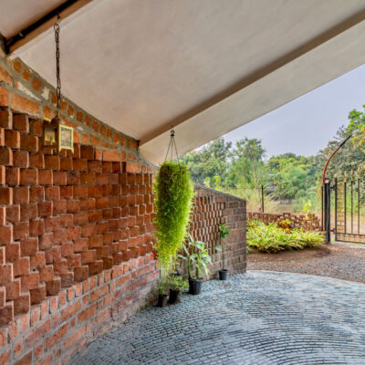 Brick archway with greenery and garden view - Sustainable, eco friendly, biophilic architects in Mumbai, India