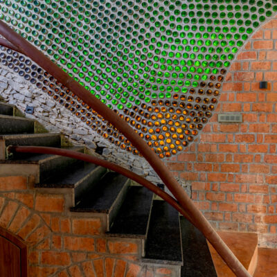 Creative staircase design with colorful glass accents - Sustainable, eco friendly, biophilic architects in Mumbai, India