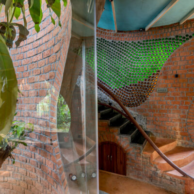 Interior brick design with greenery and staircase - Sustainable, eco friendly, biophilic architects in Mumbai, India