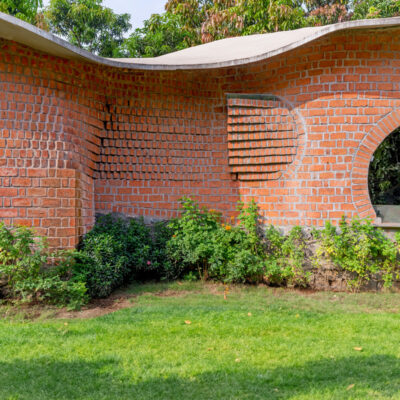 Curved brick architecture with greenery outside - Farmhouse in Alibag - Sustainable, eco friendly, biophilic architects in Mumbai, India