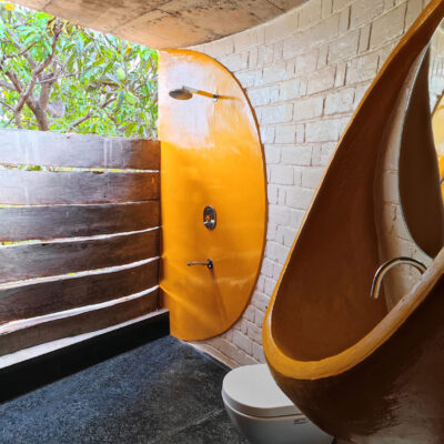 Nature-inspired bathroom design with curved elements - Farmhouse in Alibag - Sustainable, eco friendly, biophilic architects in Mumbai, India