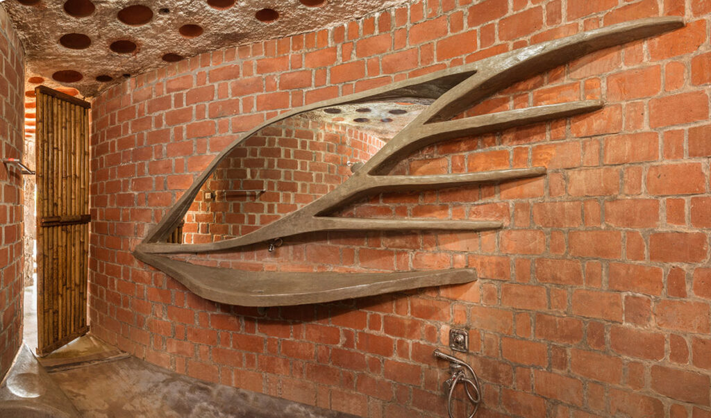 Brick house built using rat trap bond brick work